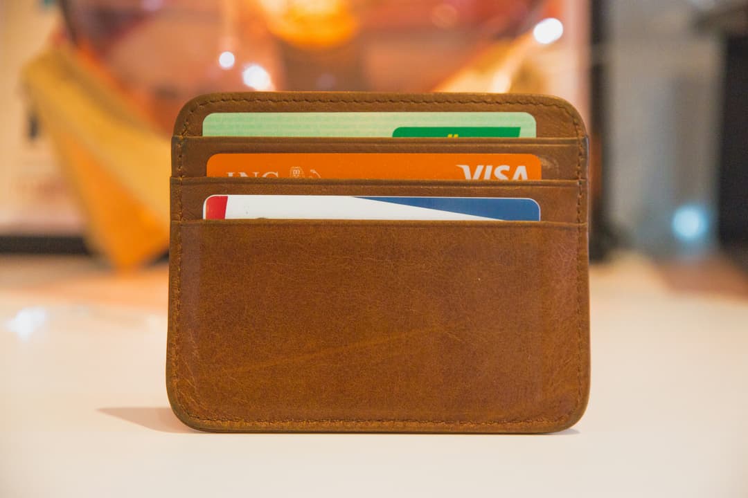 A leather wallet filled with neatly arranged credit cards, suggesting financial organization and accessibility.